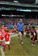22 November 2015; Dublin's Liam Rushe leads his team out for the start of the game. AIG Fenway Hurling Classic, Dublin v Galway. Fenway Park, Boston, MA, USA. Picture credit: Ray McManus / SPORTSFILE