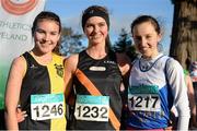 22 November 2015; Top finishers in the Junior Women's event, from left, second place Aoibhe Richardson, Kilkenny City Harriers, first place Hope Saunders, Clonliffe Harriers, and third place Deirdre Healy, Ratoath A.C., after the Junior Women's event. GloHealth National Cross Country Championships, Santry Demesne, Dublin. Picture credit: Cody Glenn / SPORTSFILE
