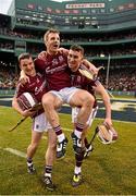 22 November 2015; Galway captain Andy Smith with team-mates Colm Flynn, left, and Jason Flynn, right, celebrates victory over Dublin. AIG Fenway Hurling Classic, Dublin v Galway. Fenway Park, Boston, MA, USA. Picture credit: Ray McManus / SPORTSFILE