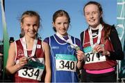 22 November 2015; Top finishers in the Under 12 Girl's event, from left,  second place Phoebe Bate, Mullingar Harriers A.C., first place Fiona Dillon, Thomastown A.C., and third place Hannah Breen, Crookstown Millview A.C.. GloHealth National Cross Country Championships, Santry Demesne, Dublin. Picture credit: Cody Glenn / SPORTSFILE