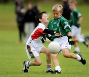 16 August 2009; Riordan O'Rourke, Ballinamore, Co. Leitrim, in action against Shay McNally, Termonmaguirc, Co. Tyrone, during the Gaelic Football Mixed Under 10's Final. HSE Community Games National Finals, Institute of Technology, Athlone, Co. Westmeath. Photo by Sportsfile