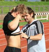 17 August 2009; Ireland's Luke Fitzgerald is fitted with a GPS system by Alan Clarke of Statsports during squad training. The monitor records distance covered, G-force, etc. during training. University of Limerick Arena, Limerick. Picture credit: Kieran Clancy / SPORTSFILE
