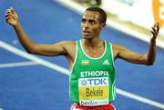 17 August 2009; Kenenisa Bekele, of Ethiopia, celebrates winning the Men's 10000m Final in a Champion Record time of 26:46.31. 12th IAAF World Championships in Athletics, Olympic Stadium, Berlin, Germany. Picture credit: Brendan Moran  / SPORTSFILE