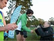 22 November 2015; Jim Dowdall, CEO of GloHealth, awards Mick Clohisey with his medal after finishing first in the Senior Men's event. GloHealth National Cross Country Championships, Santry Demesne, Dublin. Picture credit: Cody Glenn / SPORTSFILE