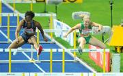 19 August 2009; Ireland's Derval O'Rourke, right, alongside Virginia Powell of the USA, on her way to finishing 4th in the Women's 100m Hurdles Final in a National Record time of 12.67 seconds. 12th IAAF World Championships in Athletics, Olympic Stadium, Berlin, Germany. Picture credit: Brendan Moran  / SPORTSFILE