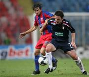 20 August 2009; Stuart Byrne, St Parick's Athletic, in action against Andre Ionescu, Steuea Bucharest. Europa League, Steaua Bucharest v St Parick's Athletic, Play-off Round, 1st Leg, Stadinul Gheneca, Bucharest, Romania. Picture credit: SPORTSFILE