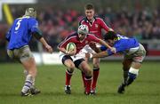 20 January 2001; Killian Keane of Munster is tackled by Eric Artiguste of Castres during the Heineken Cup Pool 4 Round 6 match between Munster and Castres at Musgrave Park in Cork. Photo by Brendan Moran/Sportsfile