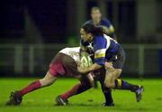 20 January 2001; Eddie Hekenui of Leinster is tackled by Pholop Bidabe of Biarritz during the Heineken Cup Pool 1 Round 6 match between Biarritz and Leinster at Park de Sport Aguilera in Biarritz, France. Photo by Matt Browne/Sportsfile