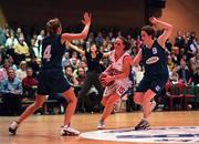 30 January 2000; Michelle Aspel of Avonmore Wildcats in action against Gillian Morris, right, and Sinead Harvey of Meteors during the Senior Women's Sprite Cup Final match between Avonmore Wildcats and Meteors at the National Basketball Arena in Tallaght, Dublin. Photo by Brendan Moran/Sportsfile