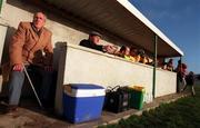 21 January 2001; Teddy Delaney, from Stradbally, watches the match along with the Meath substitutes during the O'Byrne Cup Quarter-Final match between Laois and Meath at Stradbally in Laois. Photo by Damien Eagers/Sportsfile