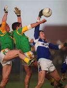 21 January 2001; Noel Garvan of Laois in action against Nigel Crawford, left, and Charles McCarthy of Laois during the O'Byrne Cup Quarter-Final match between Laois and Meath at Stradbally in Laois. Photo by Damien Eagers/Sportsfile