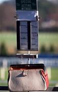 14 January 2001; On course bookmakers bag and board at Leopardstown Racecourse in Dublin. Photo by Brendan Moran/Sportsfile