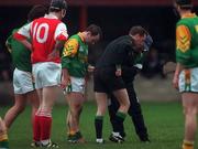 30 January 2000; Referee Eamonn Morris receives medical attention during the Kehoe Cup Quarter-Final match between Meath and Louth at Pairc Naomh Brid in Dundalk, Louth. Photo by Aoife Rice/Sportsfile