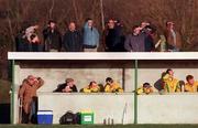 21 January 2001; The Meath substitutes watch the game with the crowd in the background during the O'Byrne Cup Quarter-Final match between Laois and Meath at Stradbally in Laois. Photo by Damien Eagers/Sportsfile