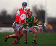 30 January 2000; Aidan Carter of Louth in action against Michael Coyle of Meath during the Kehoe Cup Quarter-Final match between Meath and Louth at Pairc Naomh Brid in Dundalk, Louth. Photo by Aoife Rice/Sportsfile