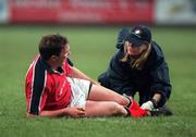 20 January 2001; John Kelly of Munster receives treatment on an injury by physio Nikki Davies during the Heineken Cup Pool 4 Round 6 match between Munster and Castres at Musgrave Park in Cork. Photo by Damien Eagers/Sportsfile