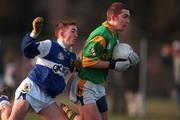 21 January 2001; Charlie McCarthy of Meath in action against Joseph Higgins of Laois during the O'Byrne Cup Quarter-Final match between Laois and Meath at Stradbally in Laois. Photo by Damien Eagers/Sportsfile