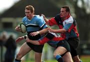 27 January 2001; Gavin Duffy of Galwegians is tackled by Sheldon Coulter and Chris McCarey of Belfast Harlequins during the AIB All-Ireland League Division 1 match between Galwegians and Belfast Harlequins at Crowley Park in Galway. Photo by Ray Lohan/Sportsfile