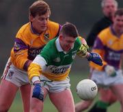 28 January 2001; Cathal Daly of Offaly is tackled by Iain Wickham of Wexford during the O'Byrne Cup Semi-Final match between Wexford and Offaly at the Gaelic Grounds in Bunclody, Wexford. Photo by Aoife Rice/Sportsfile