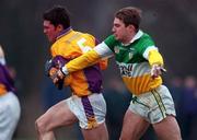 28 January 2001; Darragh Breen of Wexford is tackled by Colm Quinn of Offaly during the O'Byrne Cup Semi-Final match between Wexford and Offaly at the Gaelic Grounds in Bunclody, Wexford. Photo by Aoife Rice/Sportsfile