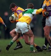 28 January 2001; Pat Forde of Wexford is tackled by Darren Quinn of Offaly during the O'Byrne Cup Semi-Final match between Wexford and Offaly in Bunclody, Wexford. Photo by Aoife Rice/Sportsfile