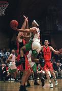 28 January 2001; Bryan Howard of Longnecks Ballina shoots for a basket despite the efforts of John Leahy of  Killester during the ESB Men's Cup Final match between Killester and Longnecks Ballina at the National Basketball Arena in Tallaght, Dublin. Photo by Brendan Moran/Sportsfile