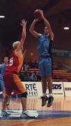 28 January 2001; Eoin Leahy of Neptune shoots two despite the attentions of Mark Kenny of Big Al's Notre Dame during the Men's U19 Cup Final match between Neptune and Big Al's Notre Dame at the National Basketball Arena in Tallaght, Dublin. Photo by Brendan Moran/Sportsfile