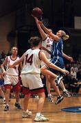 28 January 2001; Wildcats' Catriona White shoots for two as Suzanne Maguire of Tolka Rovers comes to block during the ESB Women's Cup Final match between Wildcats and Tolka Rovers at the National Basketball Arena in Tallaght, Dublin. Photo by Brendan Moran/Sportsfile