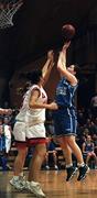 28 January 2001; Trish Nolan of Wildcats shoots for two as Vanessa Burke and Rachel Kelly of Tolka Rovers come to block during the ESB Women's Cup Final match between Wildcats and Tolka Rovers at the National Basketball Arena in Tallaght, Dublin. Photo by Brendan Moran/Sportsfile