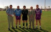 26 January 2001; Referee Brian White, centre, also pictured are, Declan O'Keeffe, captain of the 2000 All Stars, and Graham Geraghty, captain of the 1999 All Stars, GAA President, Sean McCague and Conor Murphy Irish Ambassador to the region during an exhibition match on the Eircell GAA All-Star tour at the Dubai Rugby Ground in Dubai, United Arab Emirates. Photo by Ray McManus/Sportsfile