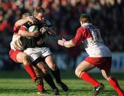 28 January 2001; Mick Galwey of Munster is tackled by Denis Avril, left, and Christophe Milheres of Biarritz during the Heineken Cup Quarter-Final match between Munster and Biarritz at Thomond Park in Limerick. Photo by Ray Lohan/Sportsfile