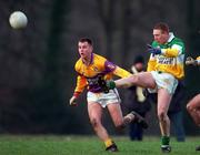 28 January 2001; Neville Coughlan of Offaly in action against Mark Carley of Wexford during the O'Byrne Cup Semi-Final match between Wexford and Offaly at the Gaelic Grounds in Bunclody, Wexford. Photo by Aoife Rice/Sportsfile