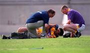 18 June 2000; Wexford team doctor, left, and goalkeeper Damien Fitzhenry, attend to Sean Flood of Wexford, after he received an injury during the Guinness Leinster Senior Hurling Championship semi-final match between Offaly and Wexford at Croke Park in Dublin. Photo by Ray McManus/Sportsfile