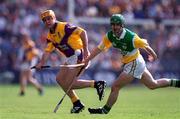 18 June 2000; Michael Jordan of Wexford in action against David Frants of Offaly during the Guinness Leinster Senior Hurling Championship semi-final match between Offaly and Wexford at Croke Park in Dublin. Photo by Ray McManus/Sportsfile