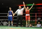 27 November 2015; Michaela Walsh, Holy Family GG Boxing Club, is declared the winner over Ceire Smith, Cavan Boxing Club, at the end of their 51kg bout. IABA National Elite Female Championship Finals. National Stadium, Dublin. Picture credit: David Maher / SPORTSFILE