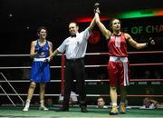 27 November 2015; Katie Taylor, Bray Boxing Club, is declared the winner over Shauna O'Keefe, Clonmel Boxing Club, at the end of their 60kg bout. IABA National Elite Female Championship Finals. National Stadium, Dublin. Picture credit: David Maher / SPORTSFILE