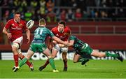 28 November 2015; Lucas Gonzalez Amorosino, Munster, offloads to team-mate CJ Stander as he is tackled by Matt Healy and AJ MacGinty, Connacht. Guinness PRO12, Round 8, Munster v Connacht. Thomond Park, Limerick. Picture credit: Diarmuid Greene / SPORTSFILE