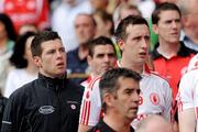 23 August 2009; Sean Cavanagh and his brother Colm, 19, sing the national anthem on the subs bench before the game. GAA Football All-Ireland Senior Championship Semi-Final, Tyrone v Cork, Croke Park, Dublin. Picture credit: Ray McManus / SPORTSFILE