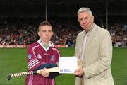 22 August 2009; Ger Cunningham, Sport Sponsorship Manager, Bord Gáis Energy, makes a presentation to the winner Colin Stankard, Clarinbridge, Co Galway, after the Bord Gáis Energy Crossbar Challenge at half-time in the Bord Gáis Energy GAA Hurling U-21 All-Ireland Championship Semi Final between Clare and Galway. Semple Stadium, Thurles, Co. Tipperary. Picture credit: Ray McManus / SPORTSFILE