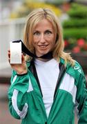 22 August 2009; World Silver Medallist Olive Loughnane arrives back in Dublin Airport after winning a silver medal in the Women's 20K Walk Final at the 12th IAAF World Championships in Berlin. Dublin Airport, Dublin. Picture credit: Damien Eagers / SPORTSFILE