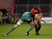 28 November 2015; Mark Chisholm, Munster, is tackled by Ultan Dillane, Connacht. Guinness PRO12, Round 8, Munster v Connacht. Thomond Park, Limerick. Picture credit: Seb Daly / SPORTSFILE