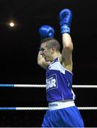 28 November 2015; Jason McKay, St. Paul's Boxing Club, Co. Antrim, celebrates his victory over Adam Courtney, St. Mary's Boxing Club, Co. Dublin, after their Flyweight 52kg Quarter-Final bout. IABA National Elite Male Championships. National Stadium, Dublin. Photo by Sportsfile