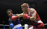 28 November 2015; Eddie Byrne, right, Na Fianna Boxing Club, Wexford, exchanges punches with Glory Lmuala Carlos, Maynooth, during their Middleweight 75kg Quarter-Final bout. IABA National Elite Male Championships. National Stadium, Dublin. Photo by Sportsfile