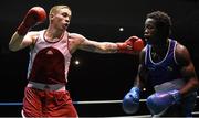 28 November 2015; Eddie Byrne, left, Na Fianna Boxing Club, Wexford, exchanges punches with Glory Lmuala Carlos, Maynooth, during their Middleweight 75kg Quarter-Final bout. IABA National Elite Male Championships. National Stadium, Dublin. Photo by Sportsfile