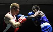 28 November 2015; Glory Lmuala Carlos, right, Maynooth, exchanges punches with Eddie Byrne, Na Fianna Boxing Club, Wexford, during their Middleweight 75kg Quarter-Final bout. IABA National Elite Male Championships. National Stadium, Dublin. Photo by Sportsfile