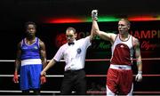 28 November 2015; Eddie Byrne, right, Na Fianna Boxing Club, Wexford, is declared winner over Glory Lmuala Carlos, Maynooth, after their Middleweight 75kg Quarter-Final bout. IABA National Elite Male Championships. National Stadium, Dublin. Photo by Sportsfile