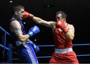28 November 2015; Darren O'Neill, right, Paulstown Boxing Club, Co. Kilkenny, exchanges punches with Stephen Lawrence, Holy Family Boxing Club, Drogheda, Co. Louth, during their Heavyweight 91kg Quarter-Final bout. IABA National Elite Male Championships. National Stadium, Dublin. Photo by Sportsfile