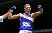 28 November 2015; Conor Wallace, St. Monica's Boxing Club, Newry, Co, Down, celebrates after being declared winner over Conor Coyle, St. Joseph's Boxing Club, Co. Derry, after their Middleweight 75kg bout. IABA National Elite Male Championships. National Stadium, Dublin. Photo by Sportsfile