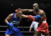 28 November 2015; Bernie O’Reilly, left, Portlaoise Boxing Club, exchanges punches with Kenneth Okungbowa, Athlone Boxing Club, during their Heavyweight 91kg Quarter-Final bout. IABA National Elite Male Championships. National Stadium, Dublin. Photo by Sportsfile