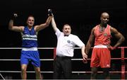 28 November 2015; Bernie O’Reilly, left, Portlaoise Boxing Club, celebrates after beating Kenneth Okungbowa, Athlone Boxing Club, during their Heavyweight 91kg Quarter-Final bout. IABA National Elite Male Championships. National Stadium, Dublin. Photo by Sportsfile
